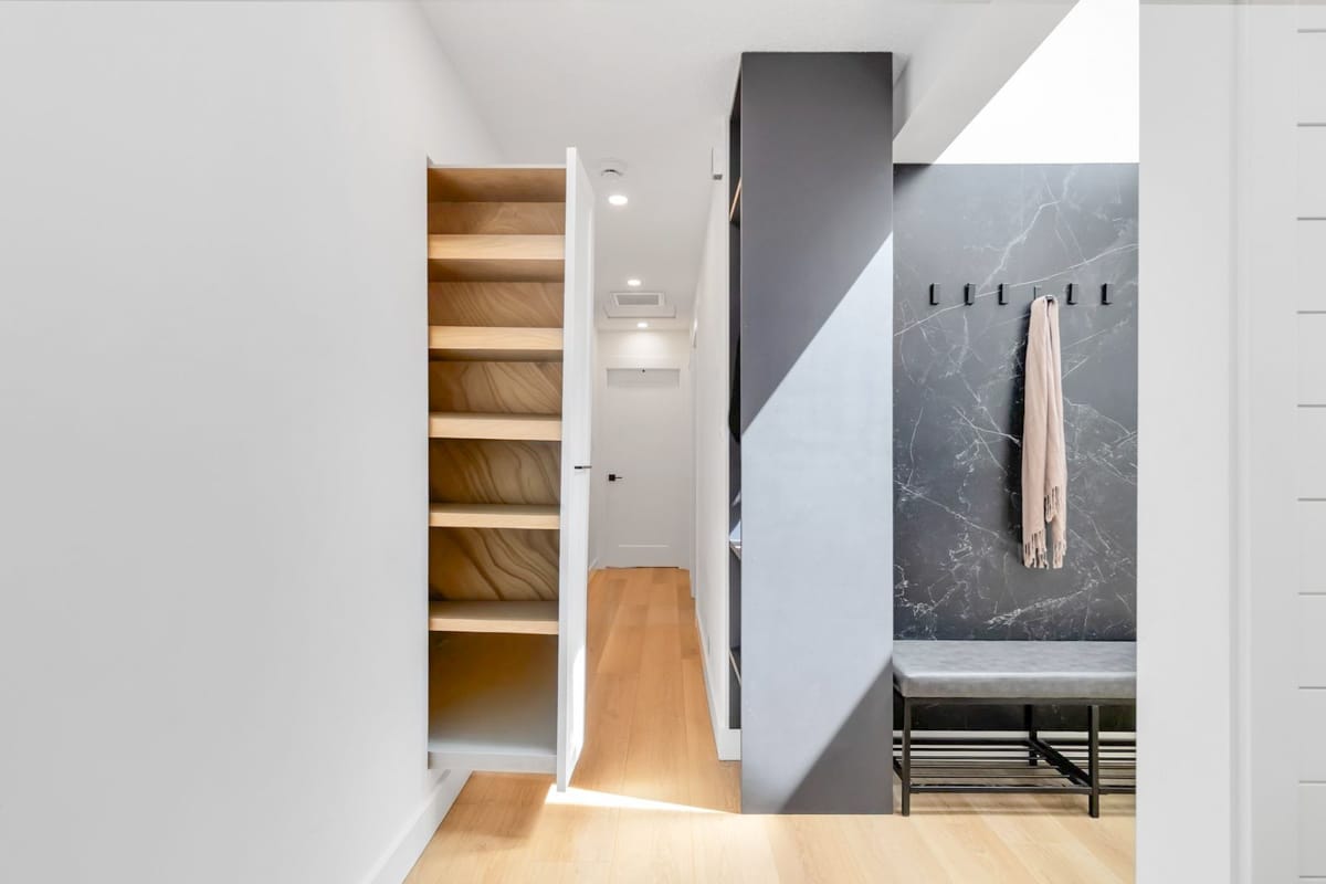 Modern hallway with wooden stairs
