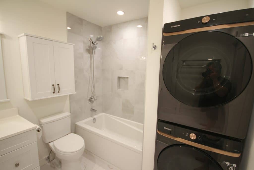 Modern bathroom with stacked washer dryer