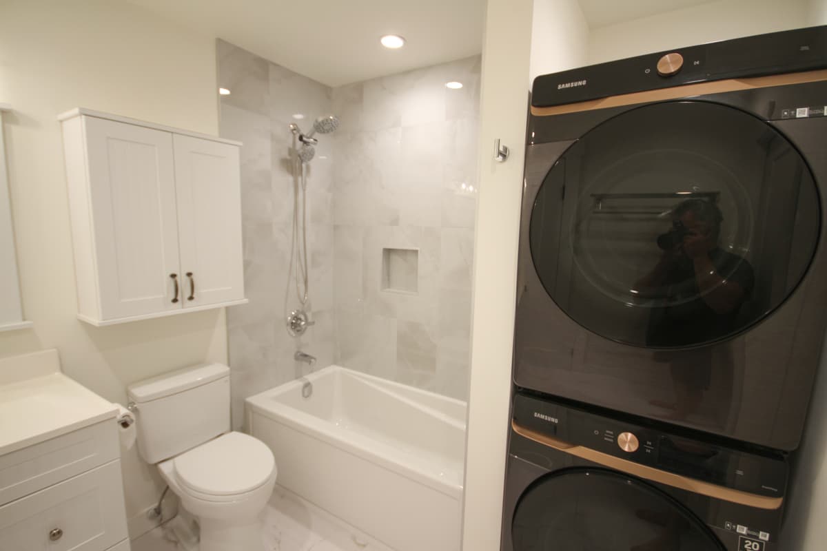 Modern bathroom with stacked washer dryer