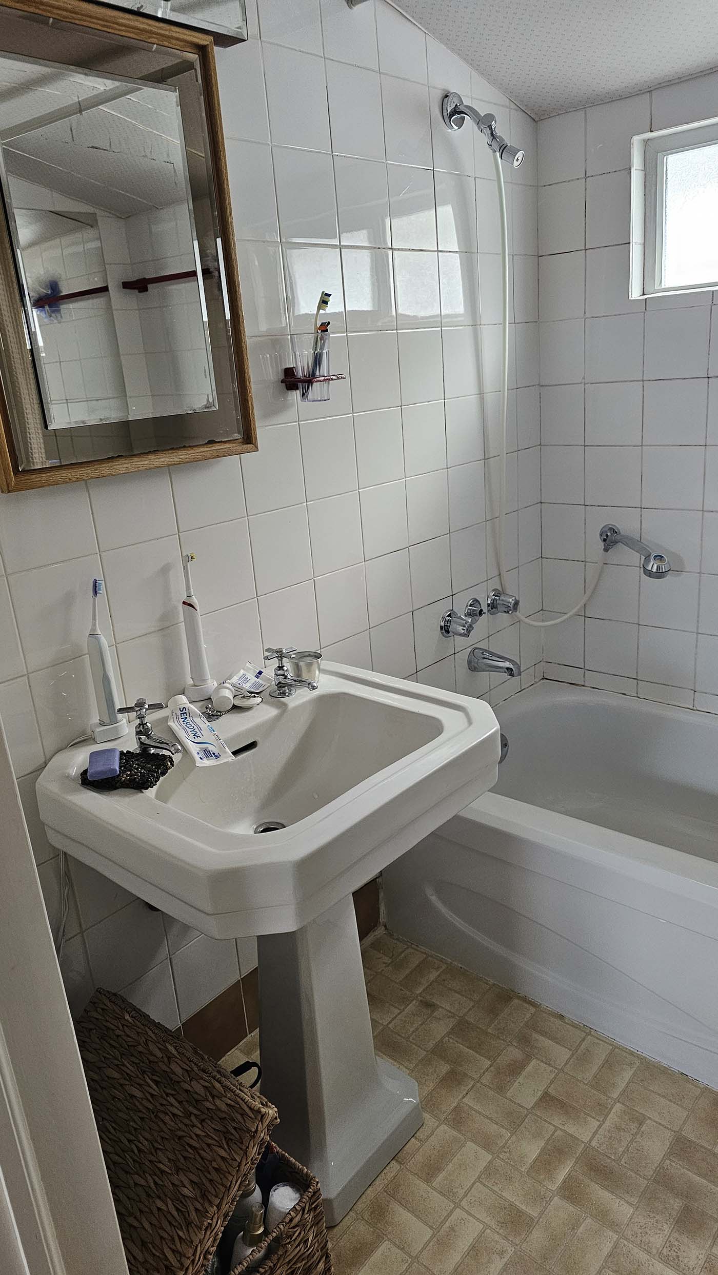 Small bathroom with sink and bathtub
