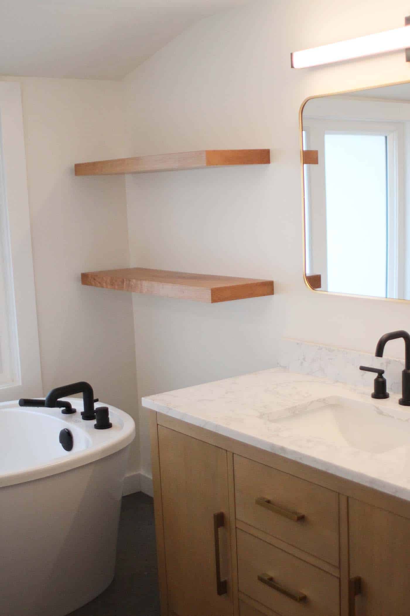 Modern bathroom with wooden shelves