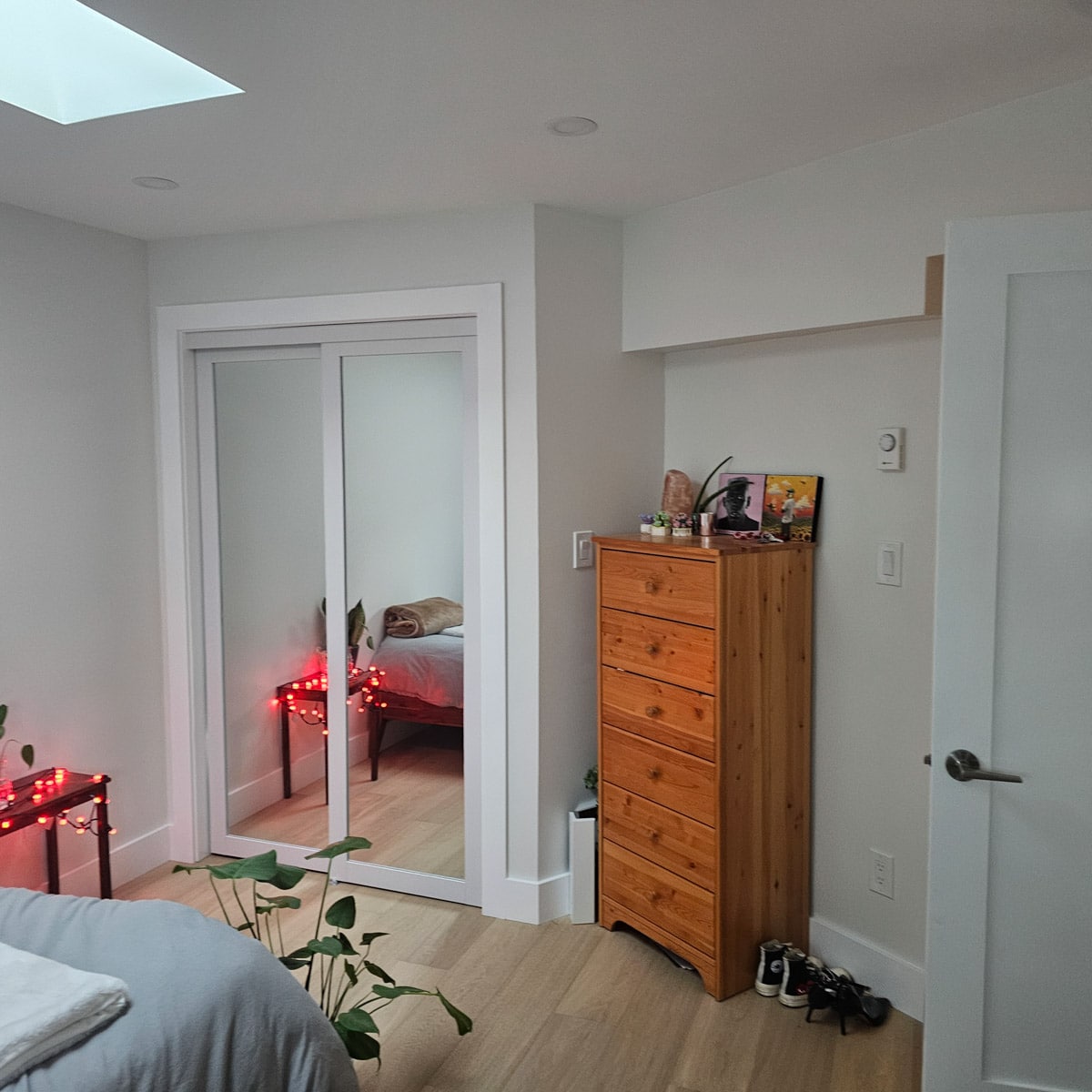 Cozy bedroom with mirrored closet doors